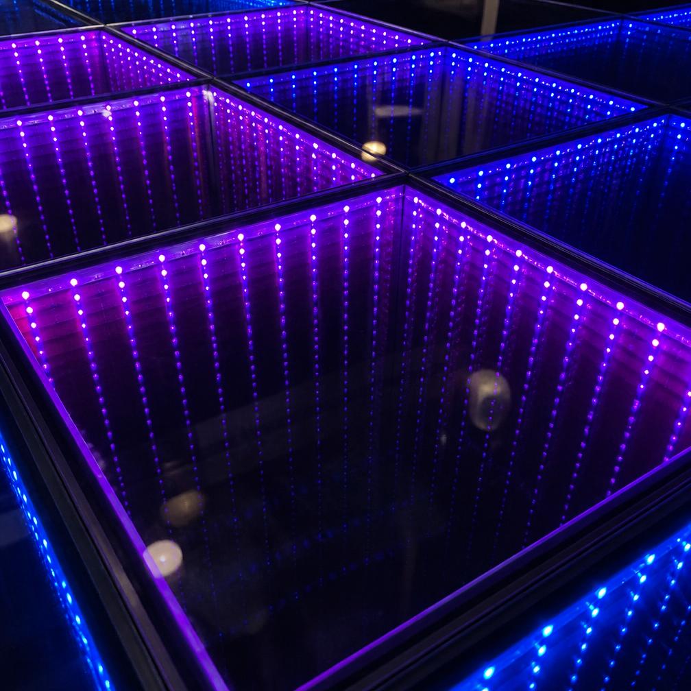 Purple lit infinity dance floor tiles showing the infinite depth effect